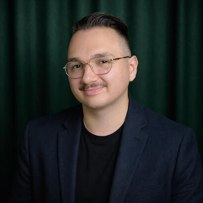 A photo of Luka looking at the camera, smiling